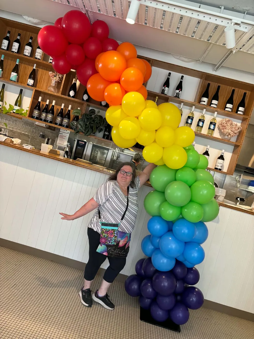 Janine, Good Cents co-owner, celebrating Pride