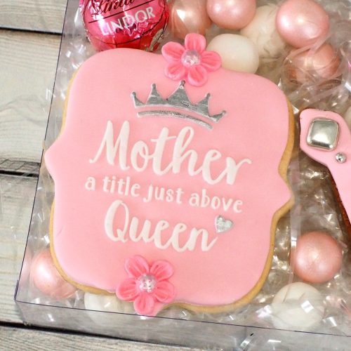 Decorated cookie showing the Mother a title above Queen design